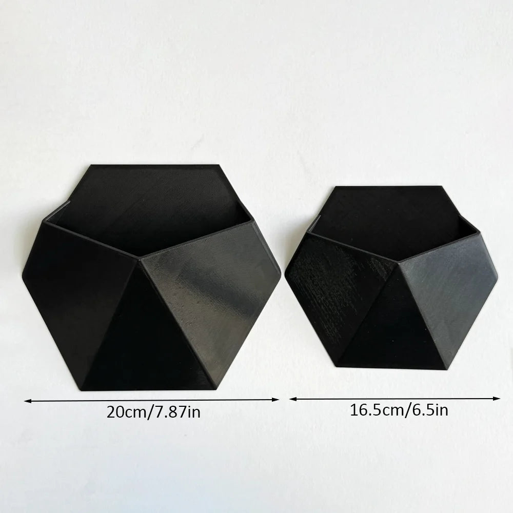 The Black Hexagonal Wall-Mounted Flower Pot Has a Simple and Unique Design. Its Hole Structure Makes It Easy to Install and Is S